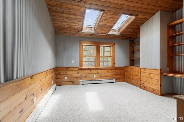 1826 Cardner Rd, Fabius, NY 13122 - unfurnished room featuring a baseboard radiator, a skylight, carpet flooring, wood walls, and vaulted ceiling