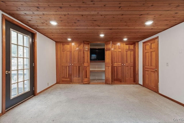 1826 Cardner Rd, Fabius, NY 13122 - unfurnished living room featuring light colored carpet, recessed lighting, wooden ceiling, and baseboards