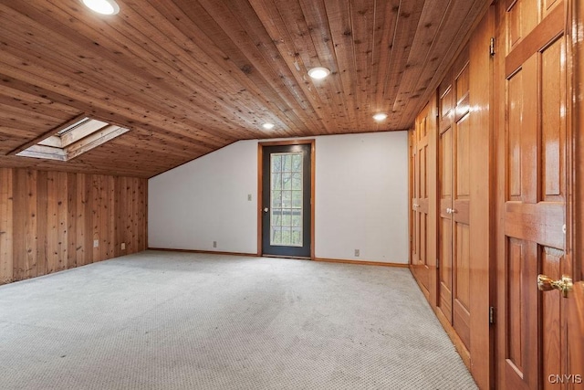 1826 Cardner Rd, Fabius, NY 13122 - additional living space with a skylight, wooden ceiling, light carpet, vaulted ceiling, and wooden walls