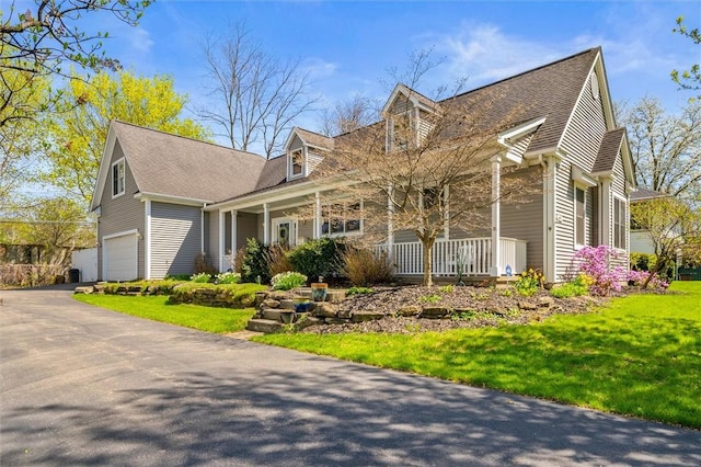 690 Hillside Ave, Rochester, NY 14610 - view of front of home featuring a porch, an attached garage, a front lawn, driveway, and roof with shingles