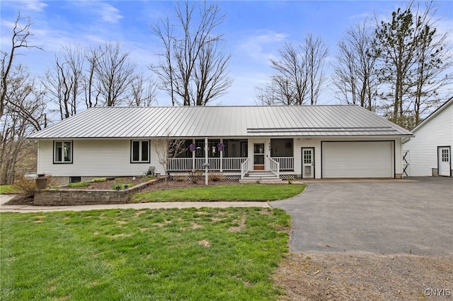 545 County Route 54, Schroeppel, NY 13132 - ranch-style house featuring covered porch, an attached garage, driveway, metal roof, and a front yard