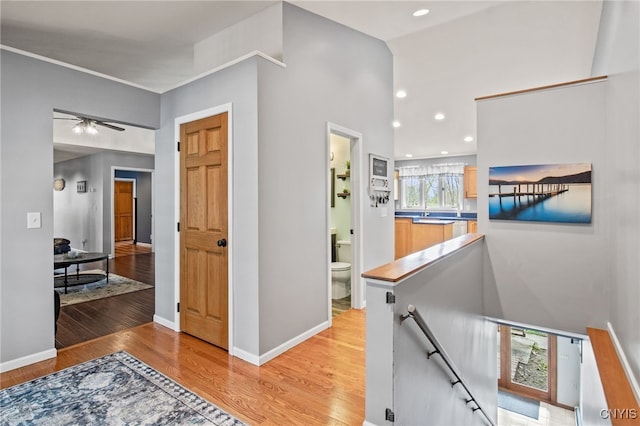 545 County Route 54, Schroeppel, NY 13132 - hallway featuring an upstairs landing, light wood-style floors, recessed lighting, and baseboards