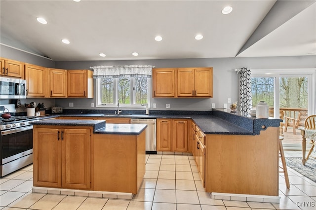 545 County Route 54, Schroeppel, NY 13132 - kitchen featuring stainless steel appliances, lofted ceiling, a sink, recessed lighting, and a center island