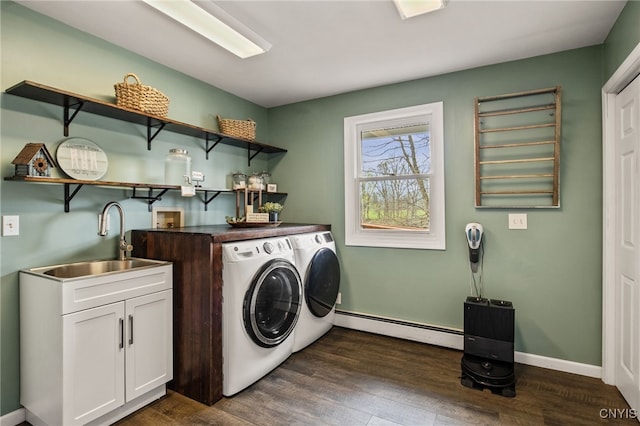 545 County Route 54, Schroeppel, NY 13132 - clothes washing area with a baseboard radiator, washer and dryer, wet bar, dark wood finished floors, and cabinet space