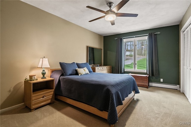 545 County Route 54, Schroeppel, NY 13132 - bedroom featuring baseboard heating, light carpet, and baseboards