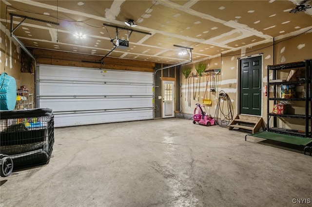 545 County Route 54, Schroeppel, NY 13132 - garage featuring a garage door opener