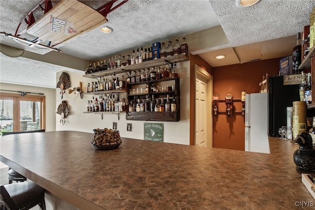 545 County Route 54, Schroeppel, NY 13132 - dining space featuring bar area and a textured ceiling