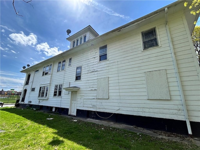 view of home's exterior featuring a yard