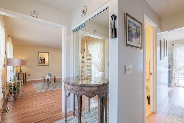 1430 Erie Station Rd, Henrietta, NY 14467 - corridor featuring light wood finished floors and baseboards