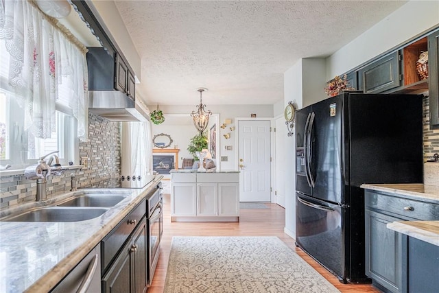 1430 Erie Station Rd, Henrietta, NY 14467 - kitchen featuring appliances with stainless steel finishes, a sink, light countertops, backsplash, and a textured ceiling