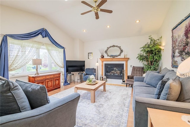 1430 Erie Station Rd, Henrietta, NY 14467 - living area featuring vaulted ceiling, a ceiling fan, light wood-style flooring, recessed lighting, and a glass covered fireplace