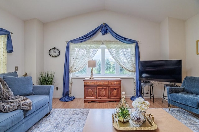 1430 Erie Station Rd, Henrietta, NY 14467 - living room featuring wood finished floors, baseboards, and lofted ceiling