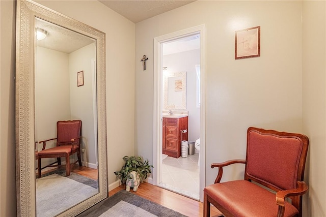 1430 Erie Station Rd, Henrietta, NY 14467 - sitting room with wood finished floors and baseboards