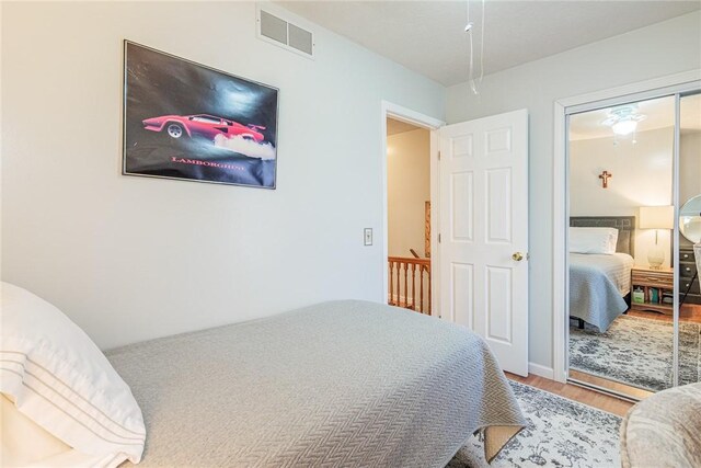 1430 Erie Station Rd, Henrietta, NY 14467 - bedroom with wood finished floors and a closet