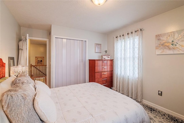 1430 Erie Station Rd, Henrietta, NY 14467 - bedroom with a closet and baseboards
