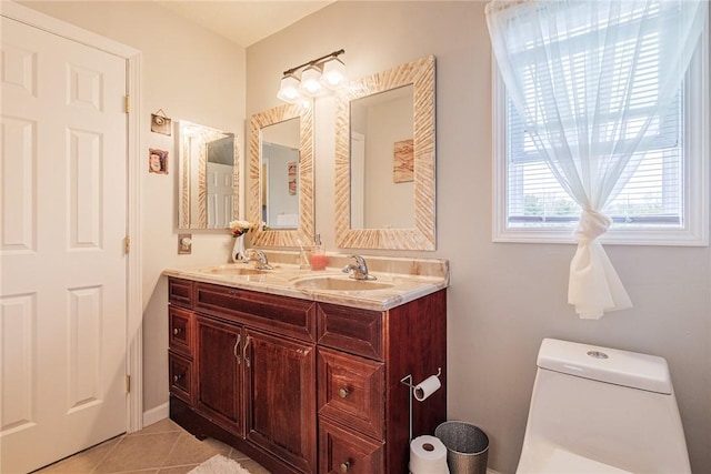 1430 Erie Station Rd, Henrietta, NY 14467 - bathroom featuring tile patterned floors, double vanity, and toilet