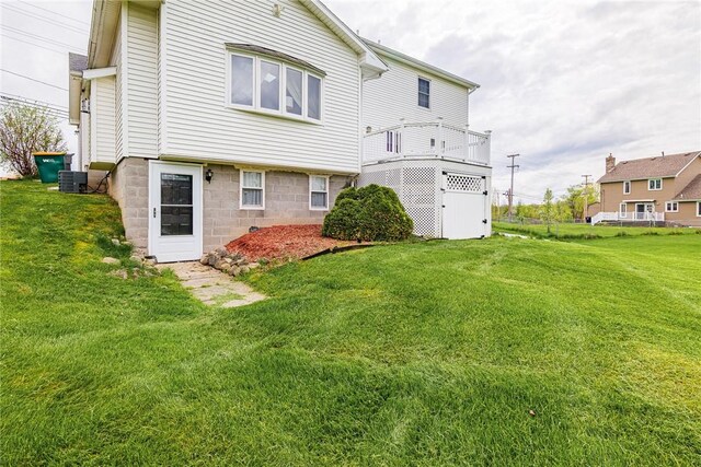 1430 Erie Station Rd, Henrietta, NY 14467 - back of property with a yard and central air condition unit