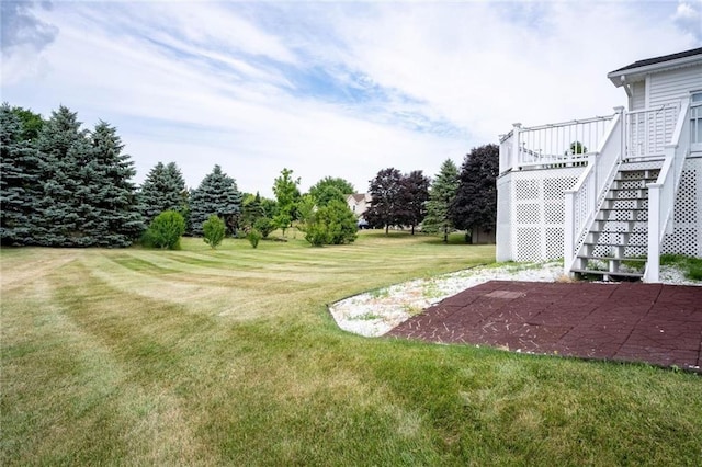1430 Erie Station Rd, Henrietta, NY 14467 - view of grassy yard featuring stairway, a patio, and a wooden deck