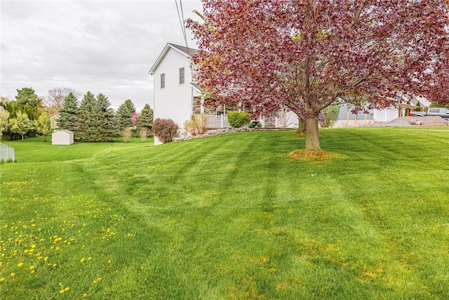 1430 Erie Station Rd, Henrietta, NY 14467 - view of green lawn with a shed and an outdoor structure