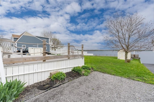 17869 County Route 59, Brownville, NY 13634 - view of green lawn featuring a water view, a storage shed, and an outdoor structure