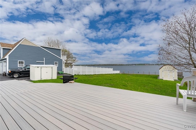 17869 County Route 59, Brownville, NY 13634 - deck featuring a storage unit, an outdoor structure, and a water view