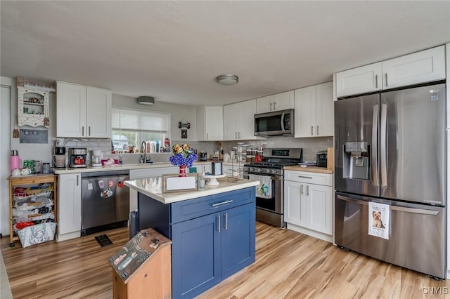 17869 County Route 59, Brownville, NY 13634 - kitchen with appliances with stainless steel finishes, light countertops, and white cabinets