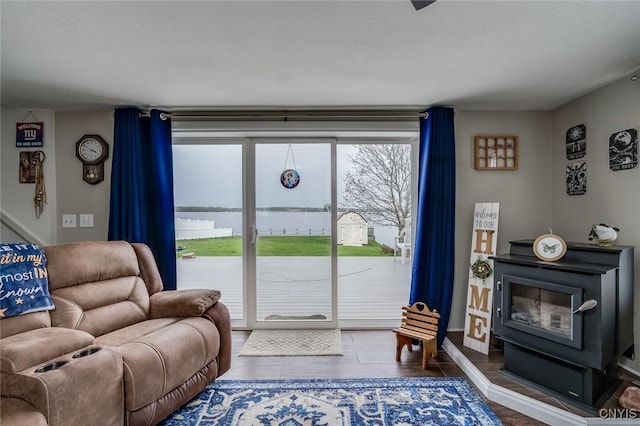 17869 County Route 59, Brownville, NY 13634 - living area featuring wood finished floors and a wood stove