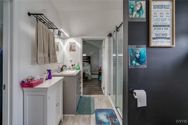 17869 County Route 59, Brownville, NY 13634 - bathroom with wood finished floors, a shower stall, and vanity