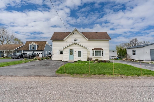 17869 County Route 59, Brownville, NY 13634 - traditional home featuring a front lawn