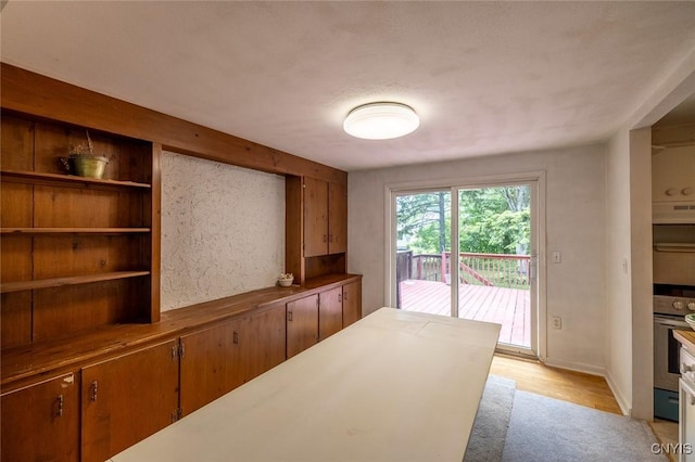 7650 Commodore Cir, Clay, NY 13090 - unfurnished dining area with light wood-style flooring and baseboards