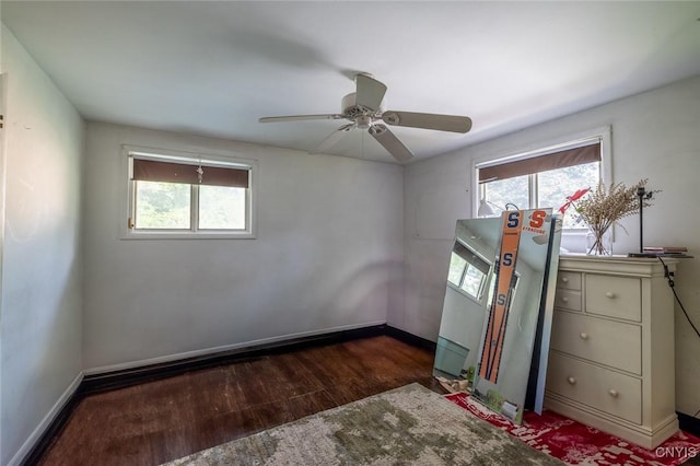 7650 Commodore Cir, Clay, NY 13090 - unfurnished bedroom with wood finished floors, baseboards, and a ceiling fan