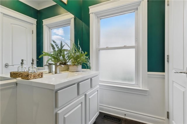 doorway with healthy amount of natural light and a sink