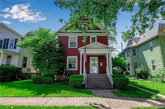 traditional style home with a front yard