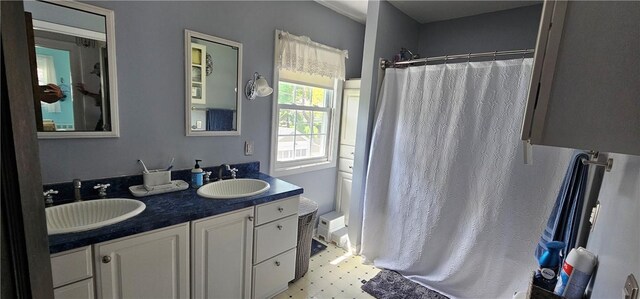 43 Sunnyside Dr, Elmira, NY 14905 - bathroom featuring curtained shower, tile patterned floors, and double vanity