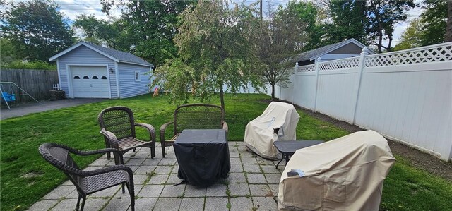 43 Sunnyside Dr, Elmira, NY 14905 - view of patio / terrace with a detached garage, an outdoor structure, and grilling area