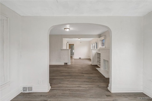 329 Jewett Ave, Buffalo, NY 14214 - corridor featuring arched walkways, baseboards, and wood finished floors