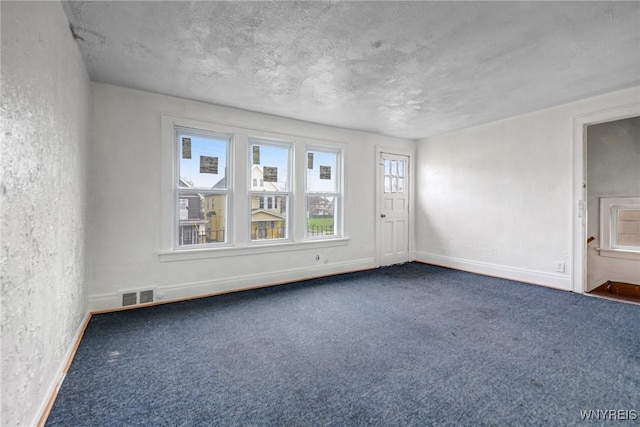 329 Jewett Ave, Buffalo, NY 14214 - spare room featuring baseboards, carpet, and a textured wall