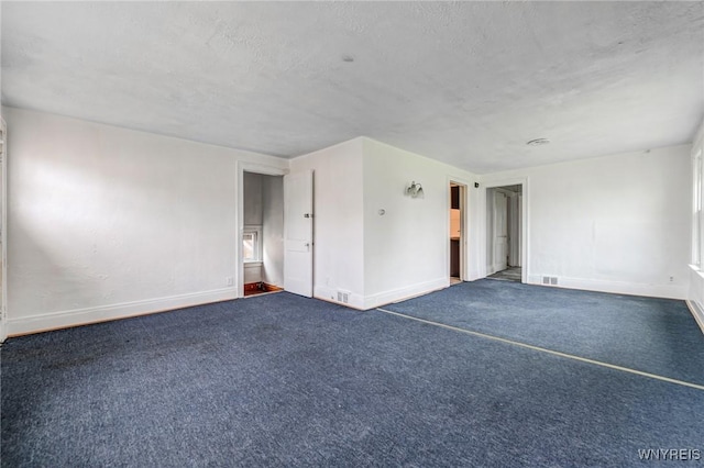 329 Jewett Ave, Buffalo, NY 14214 - carpeted empty room featuring baseboards and a textured ceiling