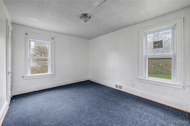 329 Jewett Ave, Buffalo, NY 14214 - spare room featuring dark colored carpet and baseboards
