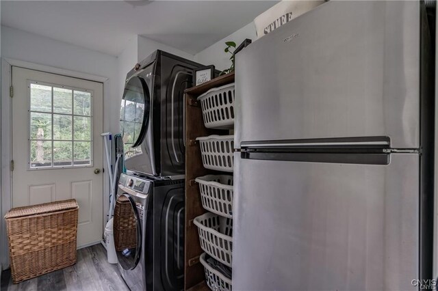 29441 Beaver Meadow Mews, Lyme, NY 13622 - laundry room with stacked washer / drying machine and wood finished floors
