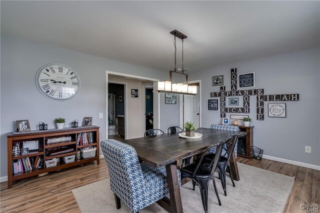 29441 Beaver Meadow Mews, Lyme, NY 13622 - dining room featuring wood finished floors and baseboards