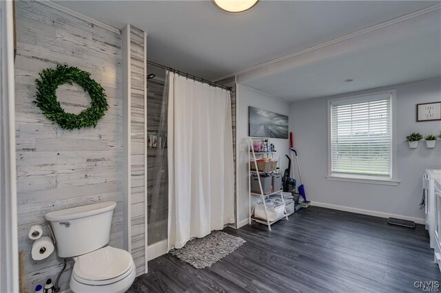 29441 Beaver Meadow Mews, Lyme, NY 13622 - full bathroom featuring toilet, a shower with shower curtain, wood finished floors, and baseboards