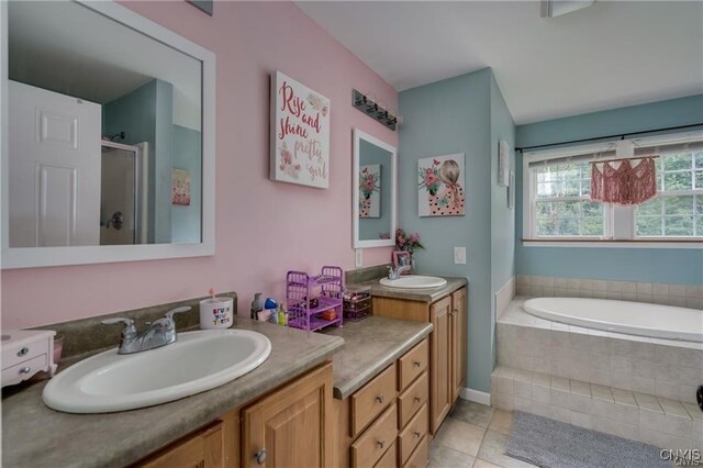 29441 Beaver Meadow Mews, Lyme, NY 13622 - bathroom featuring a stall shower, vanity, tile patterned floors, and a bath
