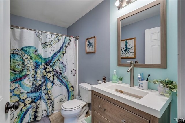 29441 Beaver Meadow Mews, Lyme, NY 13622 - bathroom featuring toilet, vanity, tile patterned flooring, and curtained shower