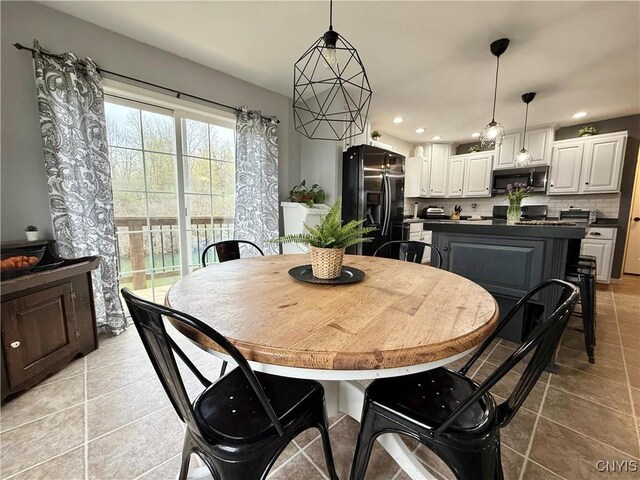 29441 Beaver Meadow Mews, Lyme, NY 13622 - dining area featuring light tile patterned floors and recessed lighting