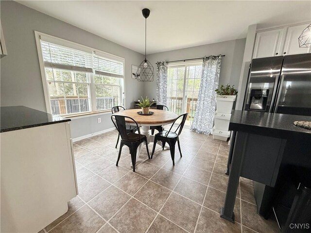 29441 Beaver Meadow Mews, Lyme, NY 13622 - dining area featuring tile patterned flooring and baseboards