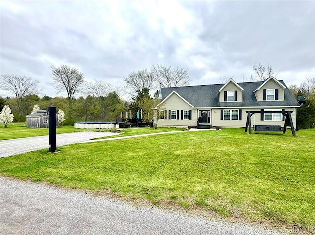 29441 Beaver Meadow Mews, Lyme, NY 13622 - view of front of house with a front yard, a storage shed, and an outdoor structure