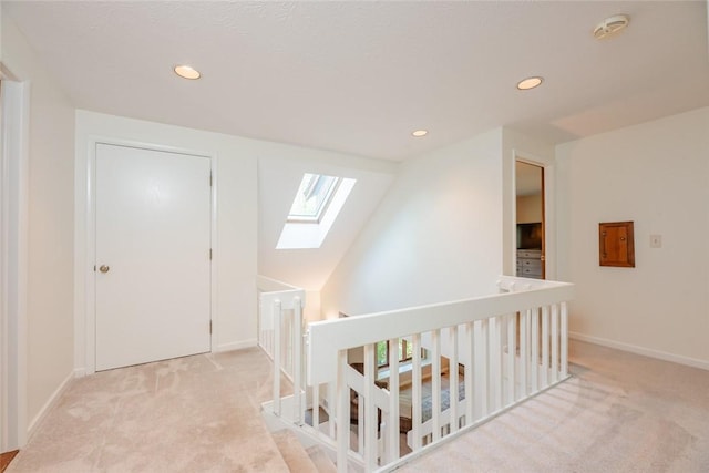 bonus room featuring a skylight, carpet flooring, recessed lighting, and baseboards