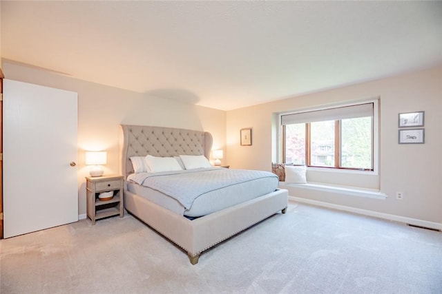 bedroom with light colored carpet
