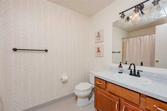 full bathroom with wallpapered walls, toilet, vanity, tile patterned flooring, and baseboards